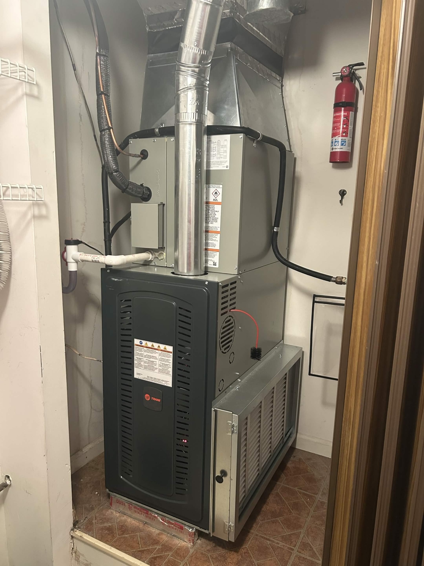 Indoor furnace installation by C&S Heating & Cooling in a utility closet.